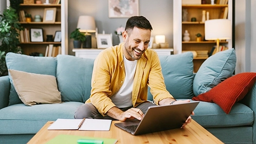 Person working on a laptop from home