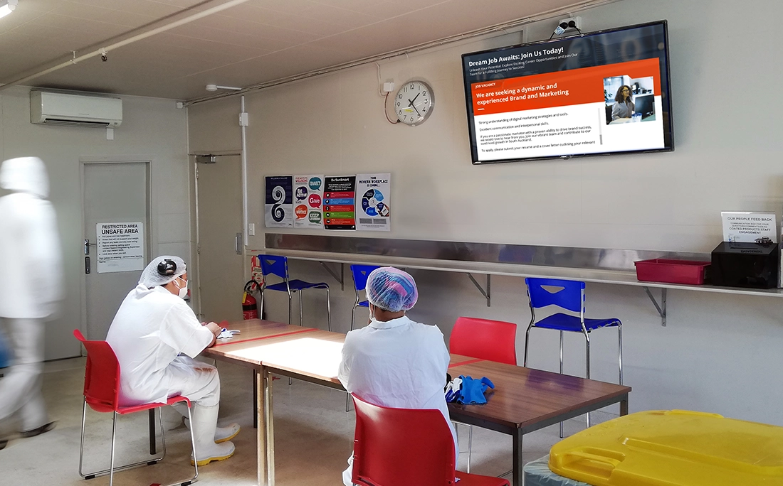 Digital screen displaying job listings and company updates