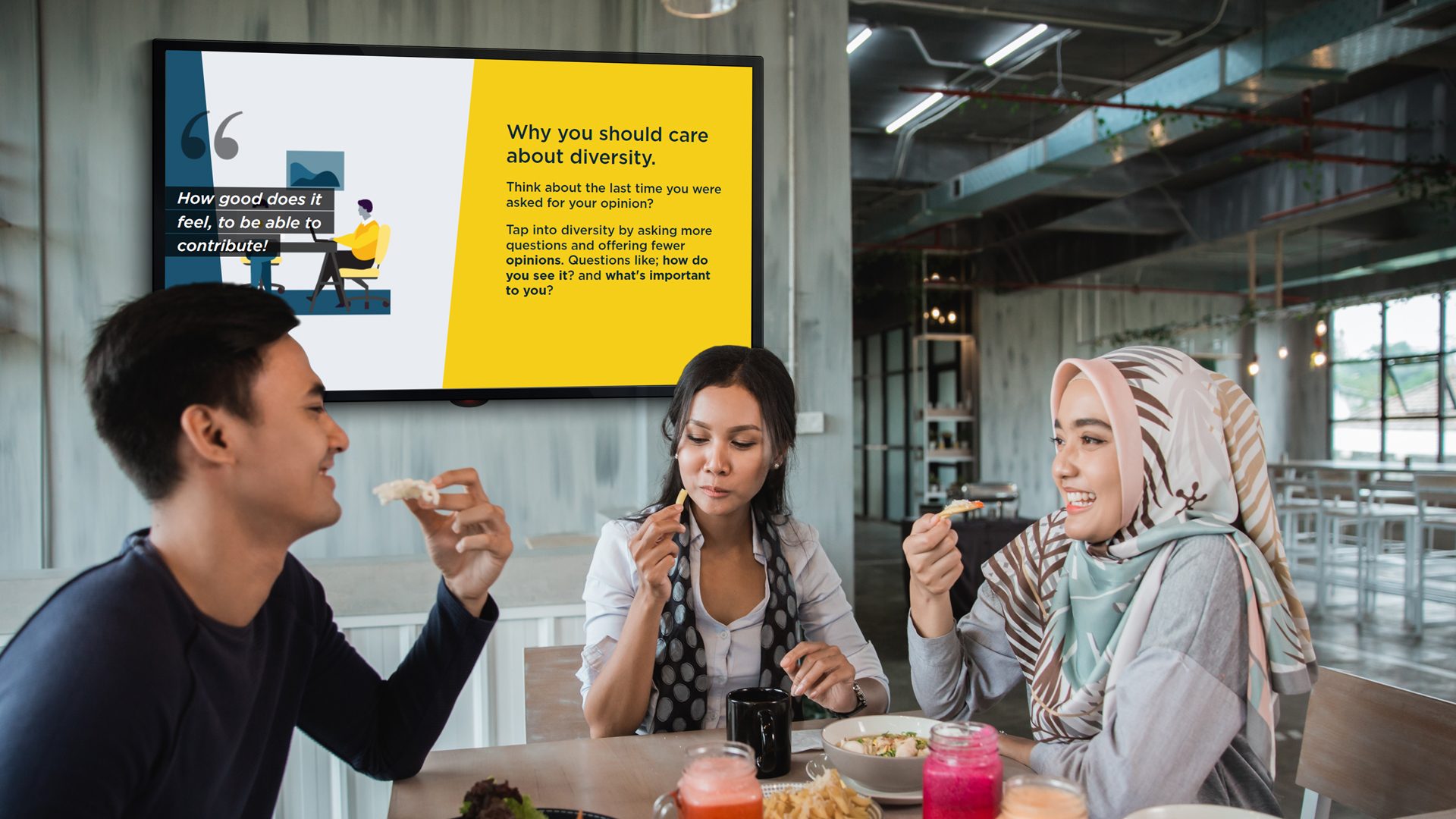 man and woman looking at a computer screen in the office
