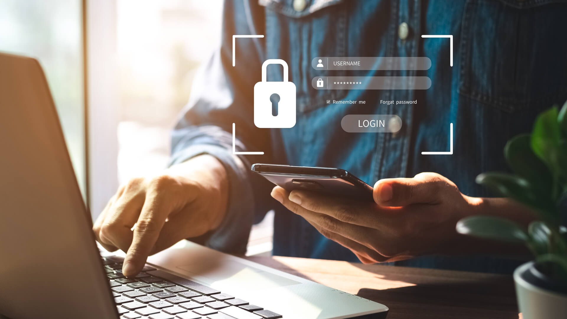 person logging into laptop using mobile phone as a 2FA