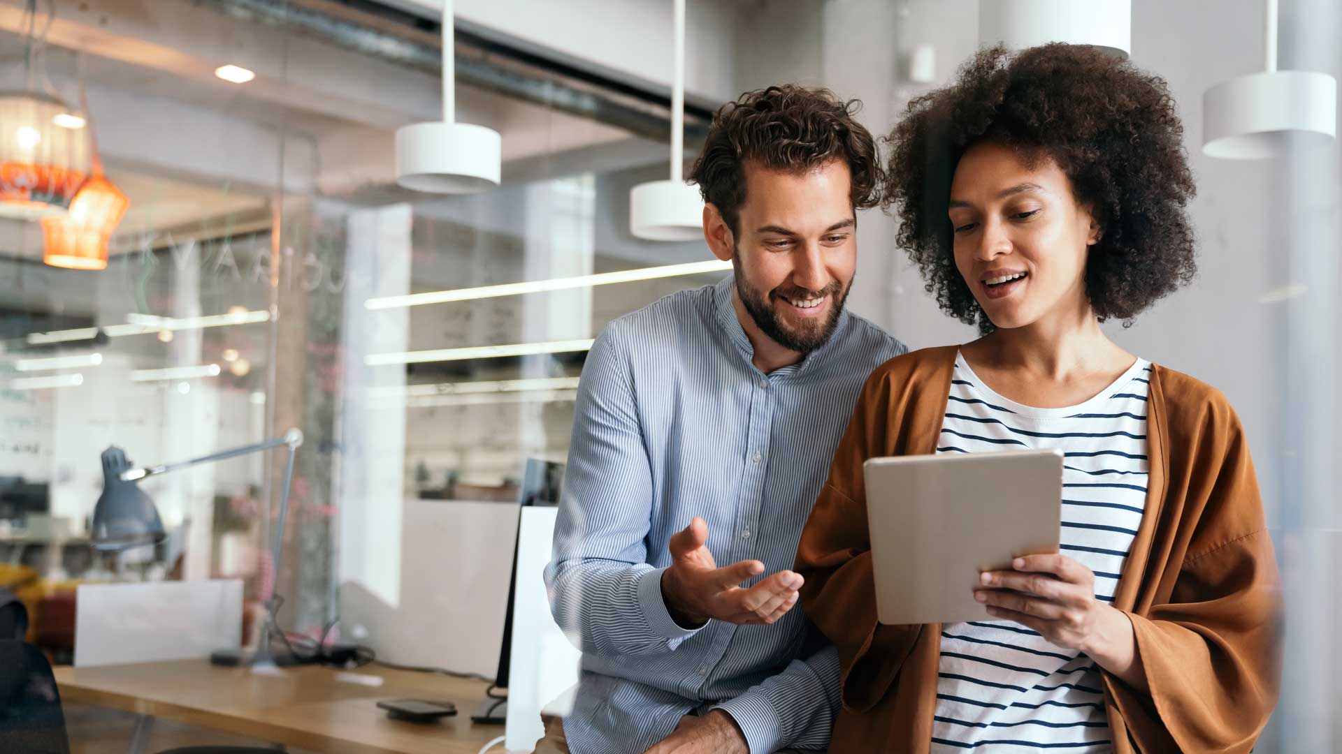Office colleagues discussing business ideas in a contemporary environment.